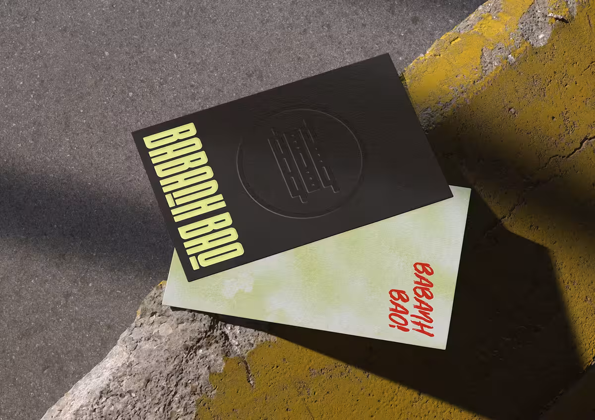 Babanh Bao embossed black card paired with neon green design element.