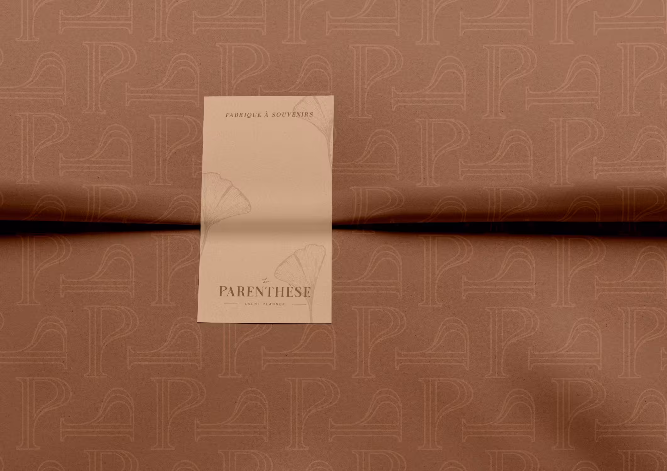 La Parenthèse brown wrapping paper with "P" brand pattern and beige label.